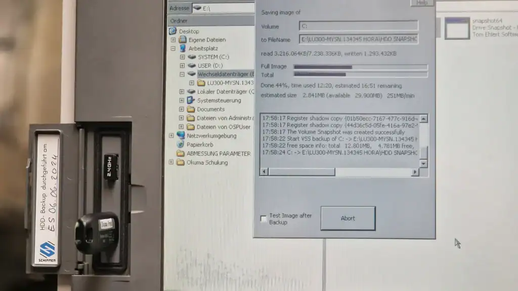 Okuma OSP CNC control system screen during data backup and diagnostics